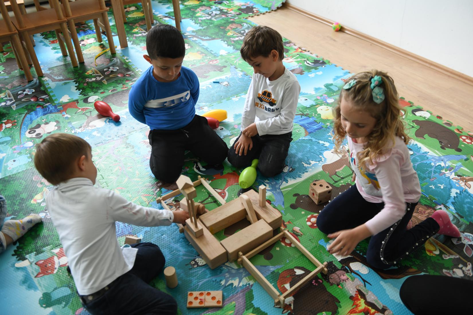 kids playing with wooden toys